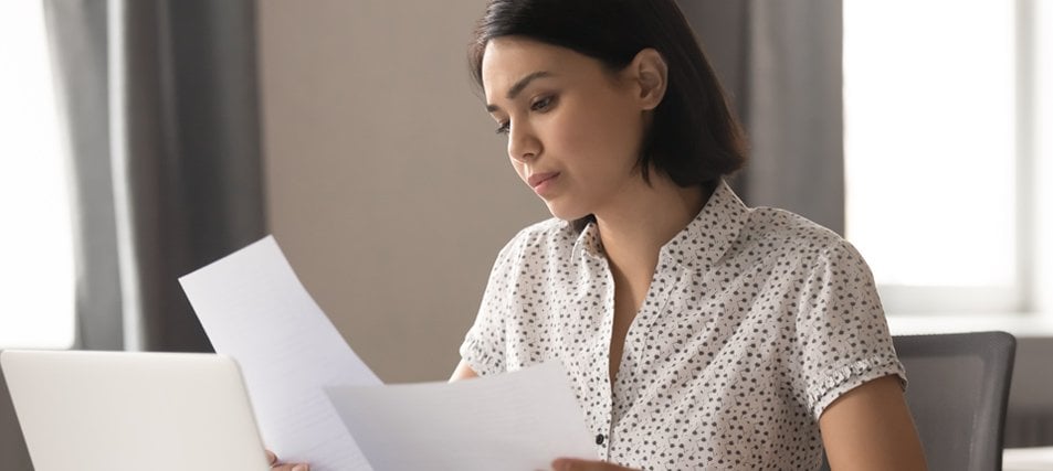 female students reading forms